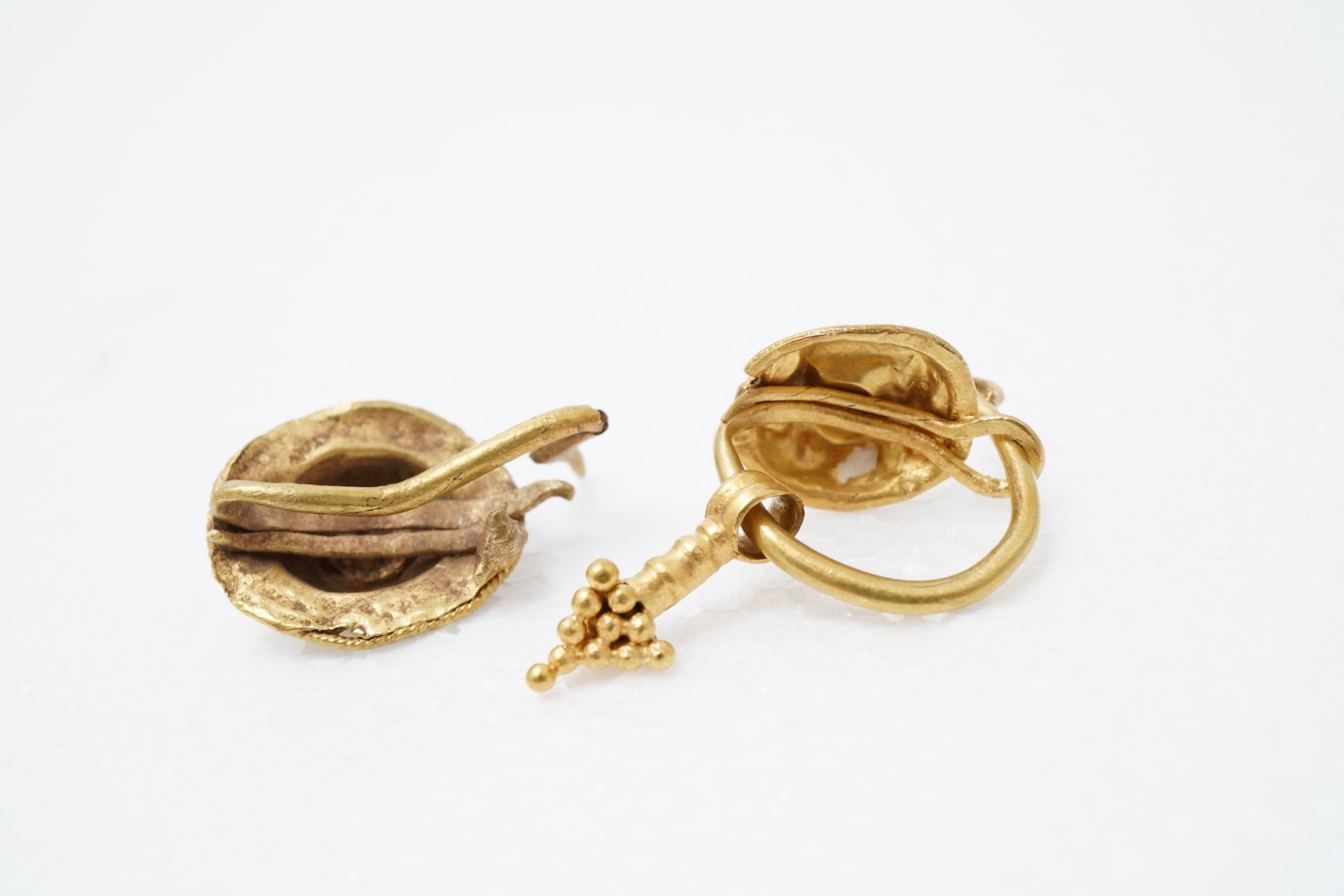 Two Roman gold earrings, circa 3rd-4th century AD